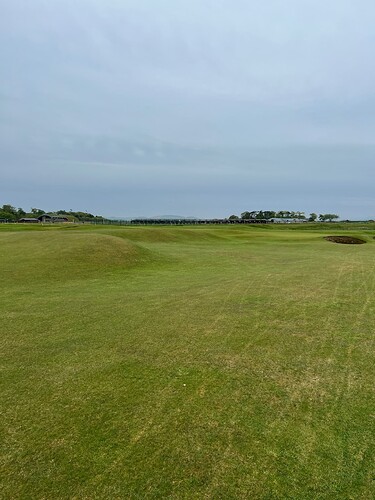My view of the second green from the fairway. A much better drive, 250 yds straight down the pipe leaving me about 155yds. Hit a sweet 8i, and two-putted for a second par. <br />