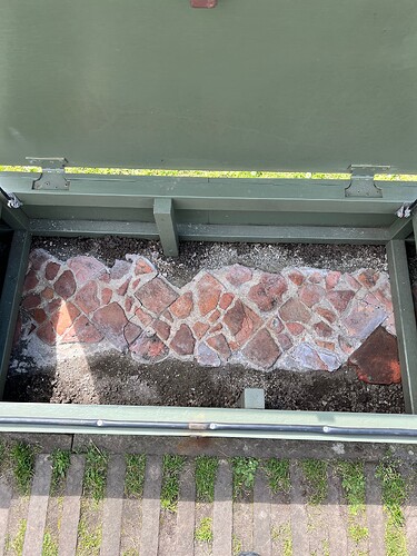 A mosaic from the floor of the cathedral. The two sections are protected from the weather by wooden boxed.