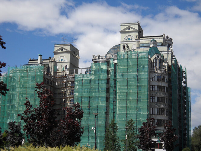 There is construction taking place everywhere you turn in Moscow. Including up...where workers were rappelling from the roof in order to paint this building.