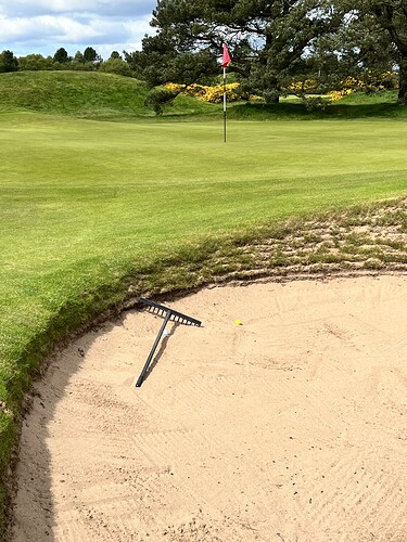 Mitch will hit the greatest bunker shot I’ve ever seen live, other than my own, when he squats on the lip, and hits a ball that sits 2 feet below his own, out to about 8 feet from the cup. Incredible.