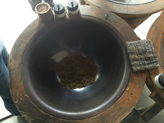 Tea gets dried in this after adding some tea tree wax. The best driers can tell the correct temperature by the feel on their hand.