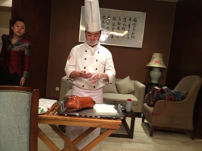 This man takes his Peking duck carving seriously.