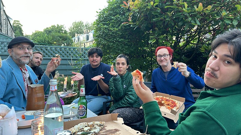 Enjoying a pizza party at Henry's place. Can you find me?